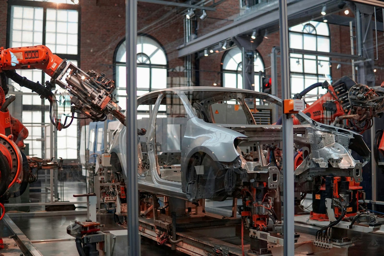 Robotic arms on a car body assembly line