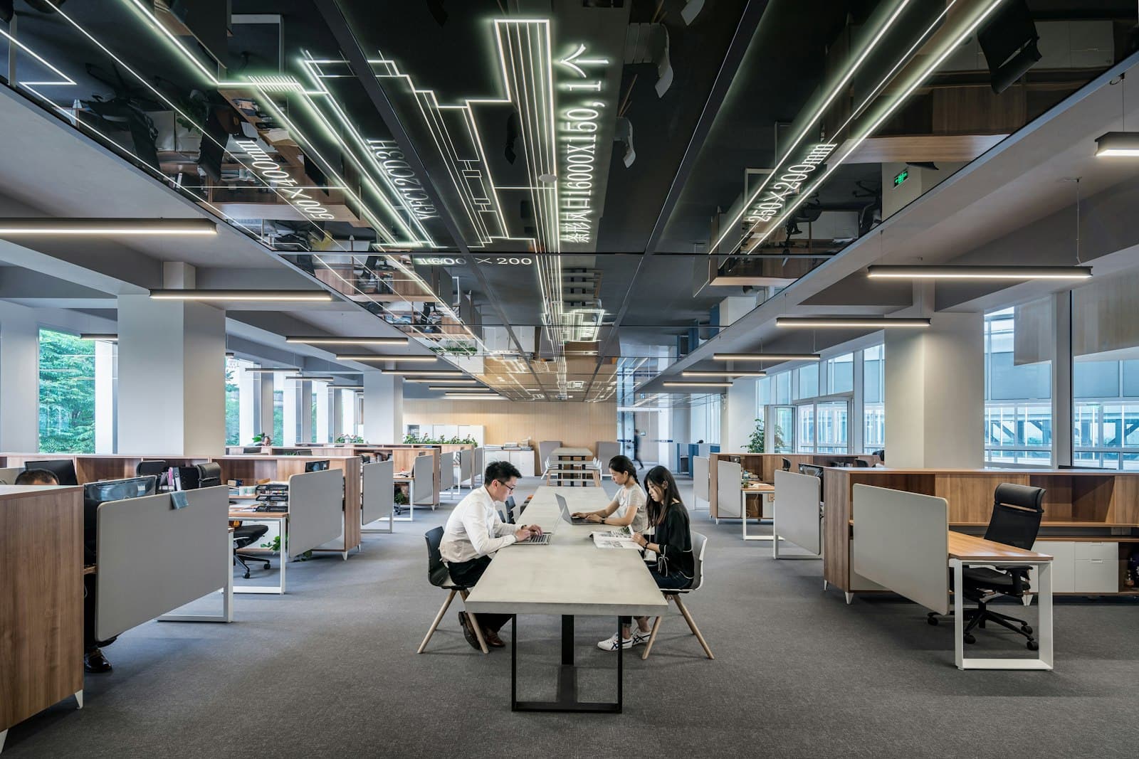 A wide open-plan office with people at work