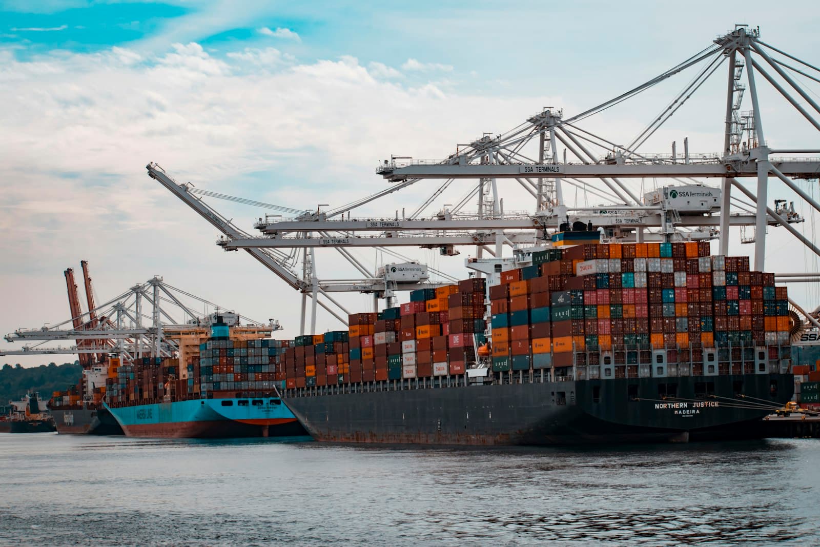 Photo: Unsplash A container ship being loaded at a port