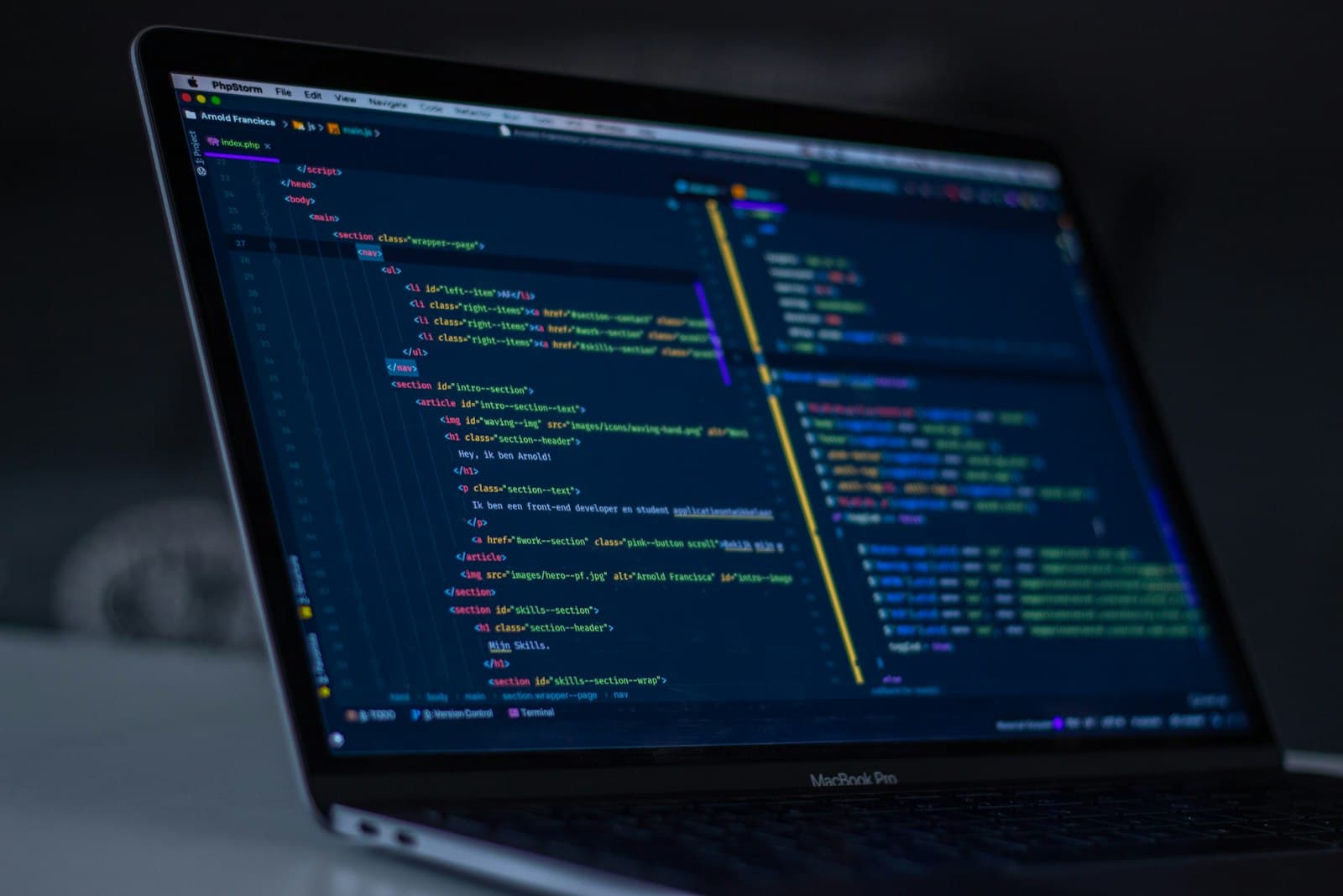 Photo: Luca Bravo, Unsplash A laptop displaying code, on a desk