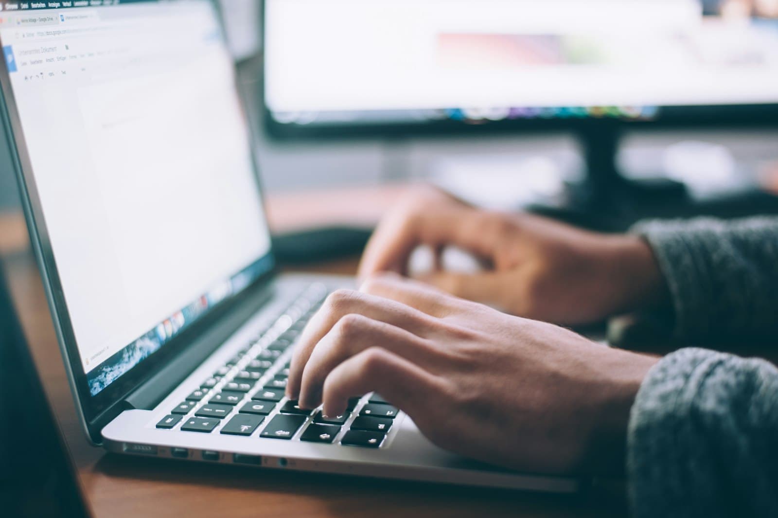 Photo: Sergey Zolkin, Unsplash Hands typing on a laptop keyboard