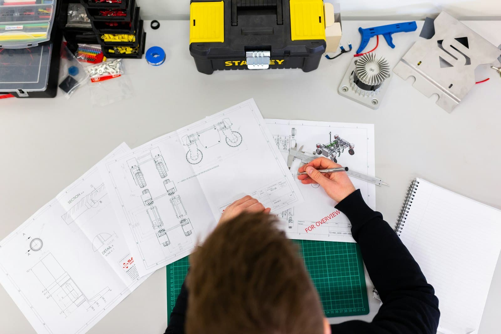 Photo: ThisisEngineering RAEng, Unsplash A designer sketching interface ideas on paper
